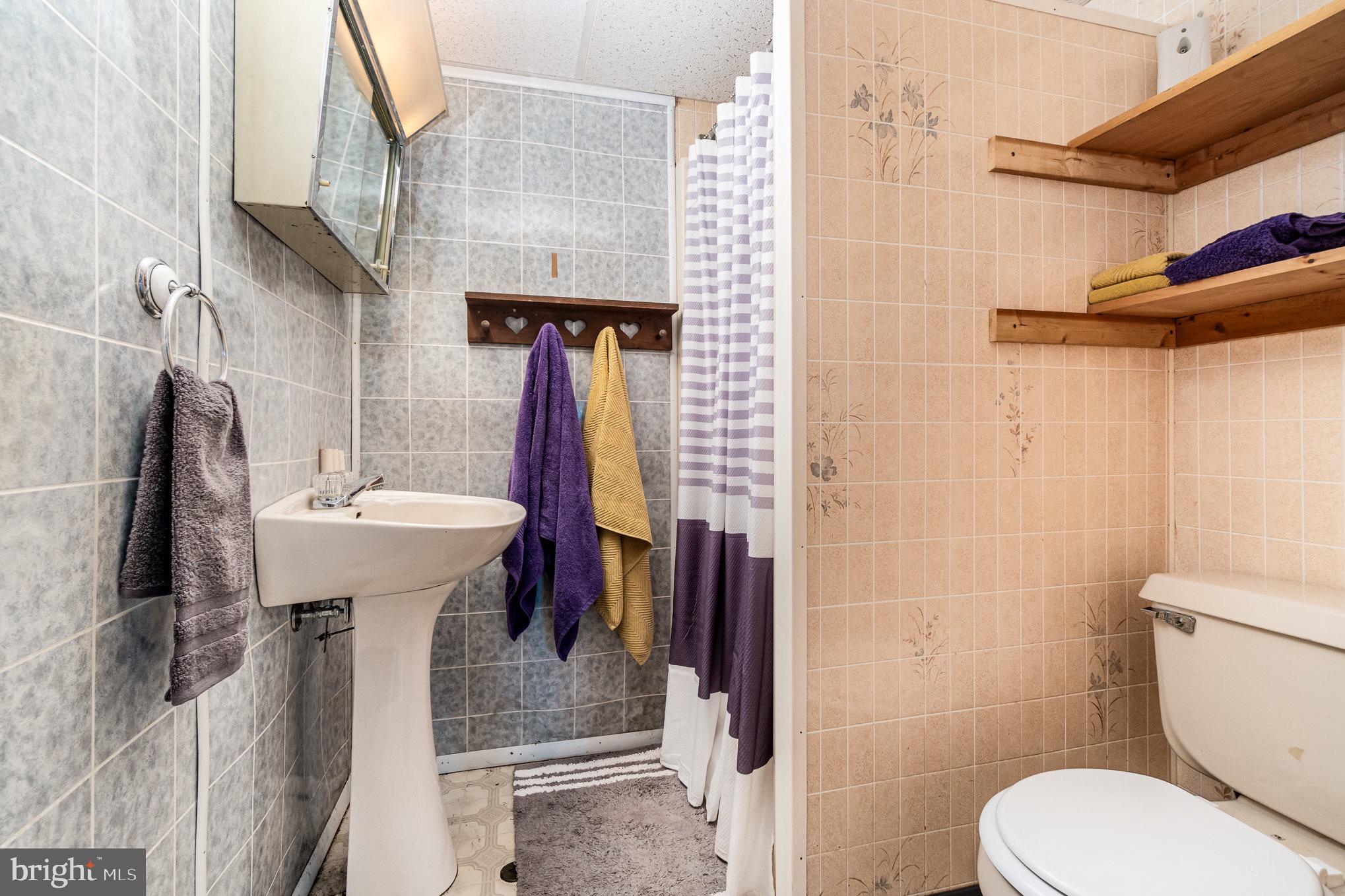 335 Apple Ridge Road Loysville, PA 17047 - Photo 31 of 46 a bathroom with a sink toilet and shower