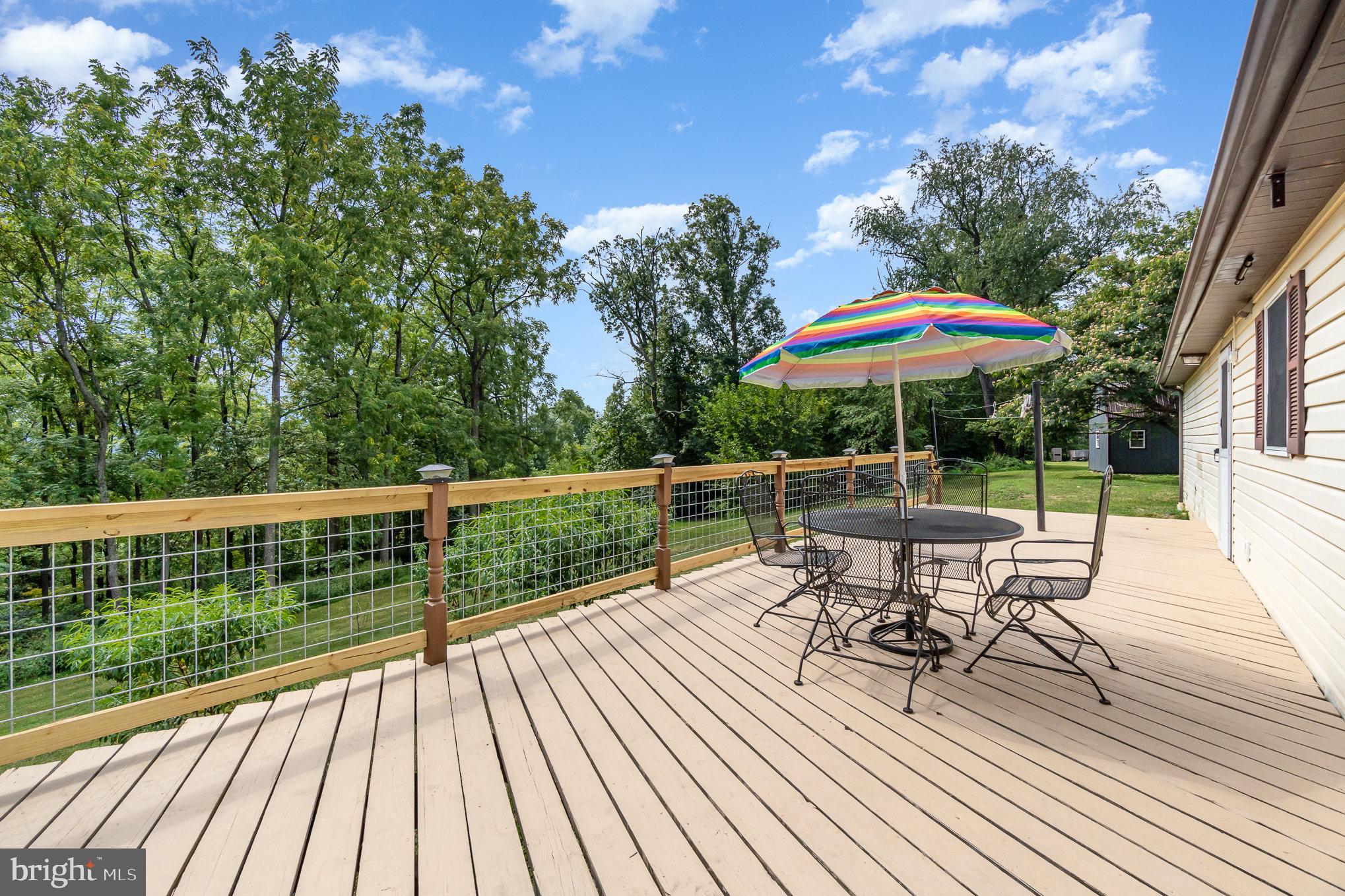 335 Apple Ridge Road Loysville, PA 17047 - Photo 32 of 46 a view of balcony with outdoor seating and wooden floor