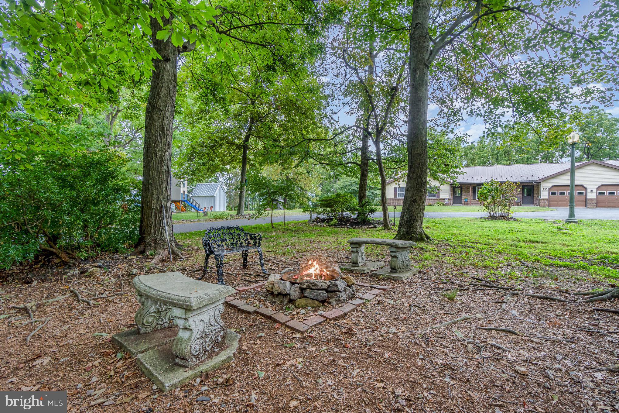 335 Apple Ridge Road Loysville, PA 17047 - Photo 37 of 46 a view of a backyard with garden and patio