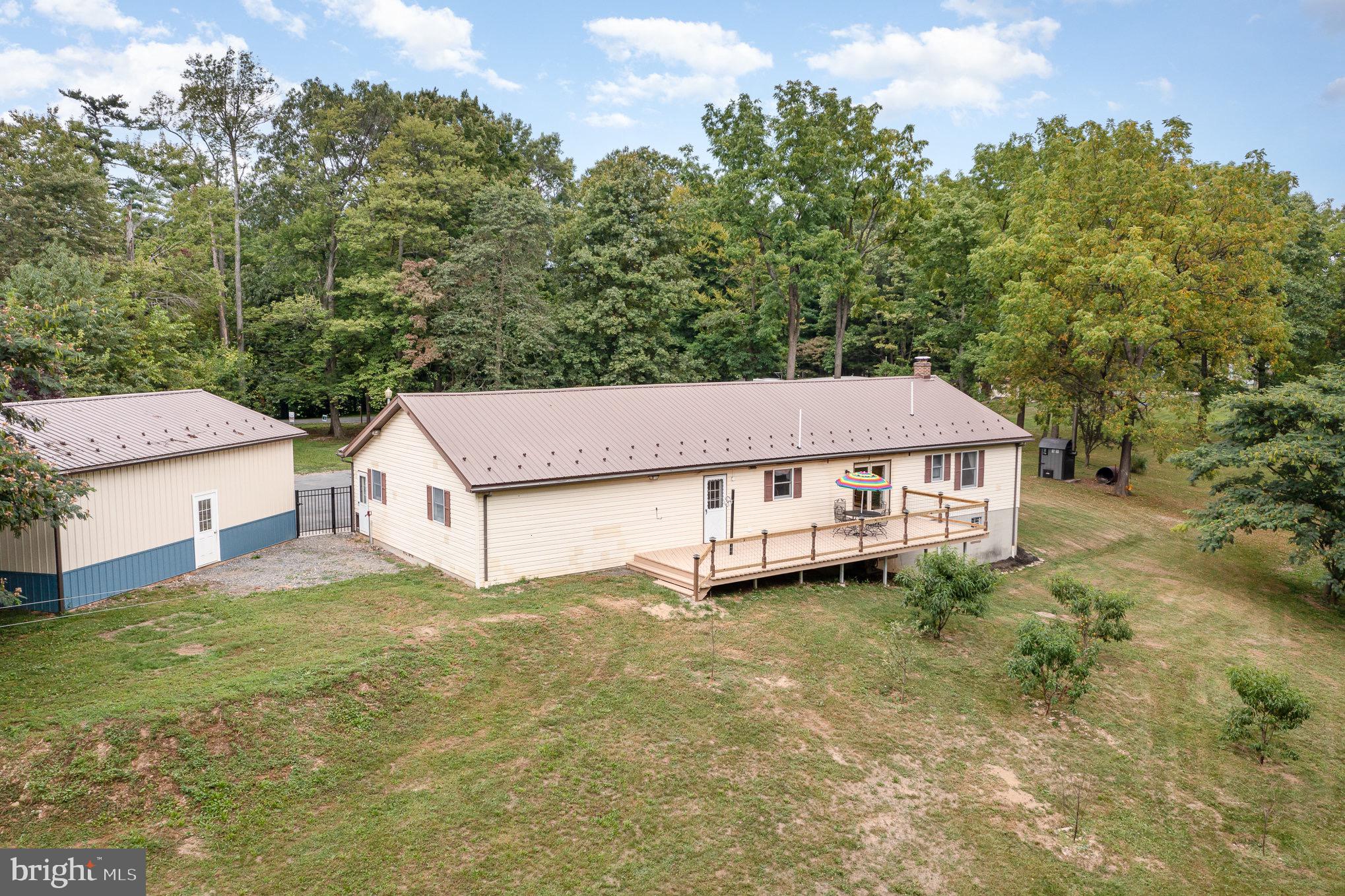 335 Apple Ridge Road Loysville, PA 17047 - Photo 41 of 46 a view of a white house with a big yard and large trees