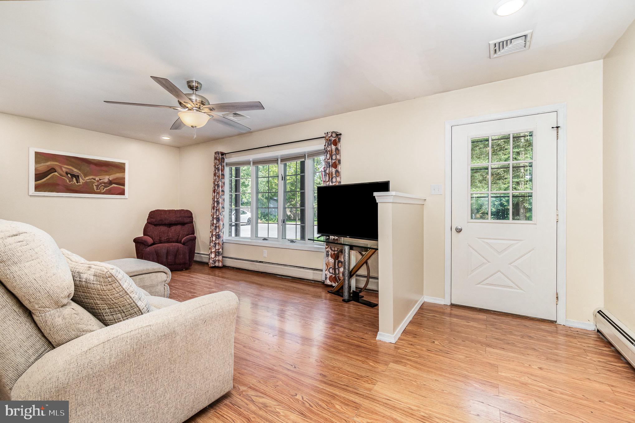 335 Apple Ridge Road Loysville, PA 17047 - Photo 6 of 46 a living room with furniture and a flat screen tv