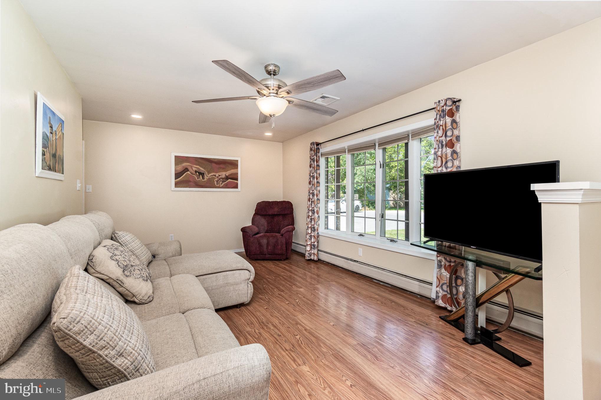 335 Apple Ridge Road Loysville, PA 17047 - Photo 7 of 46 a living room with furniture and a flat screen tv