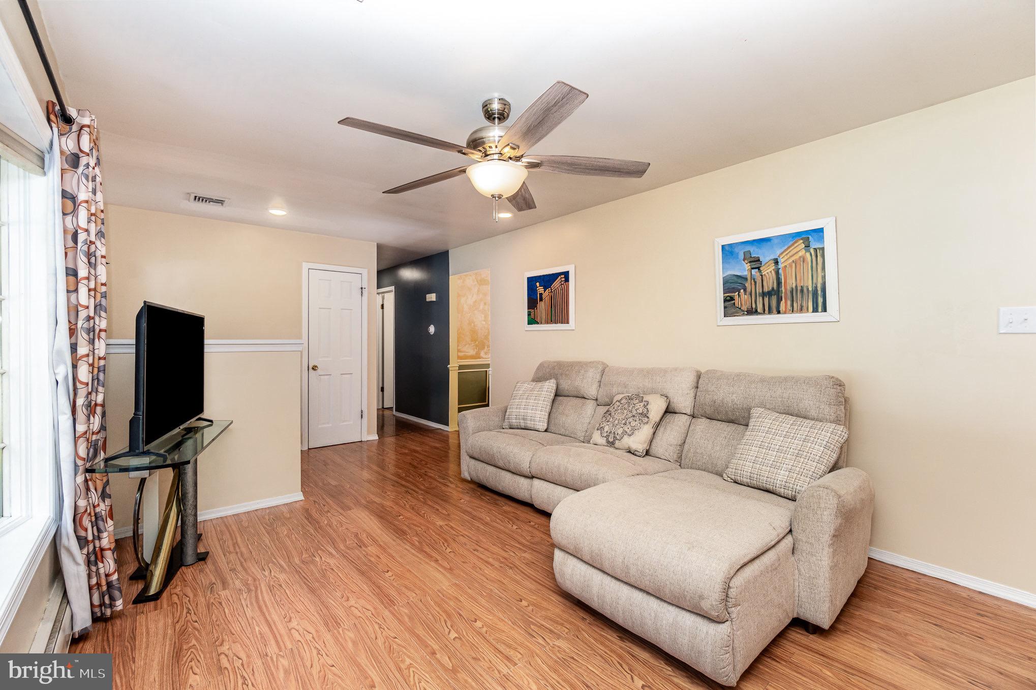 335 Apple Ridge Road Loysville, PA 17047 - Photo 8 of 46 a living room with furniture and a flat screen tv