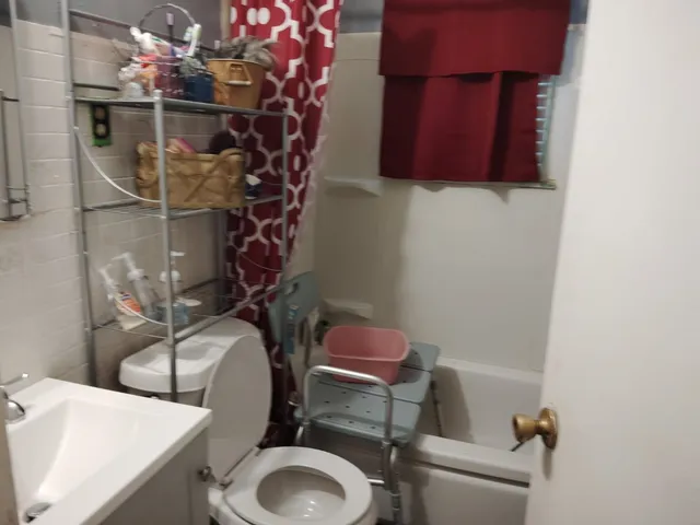 a bathroom with a toilet with a sink