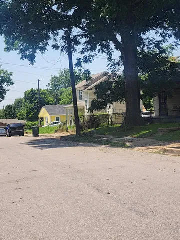 a view of a park with of a house