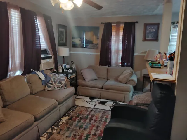 a living room with furniture and a window