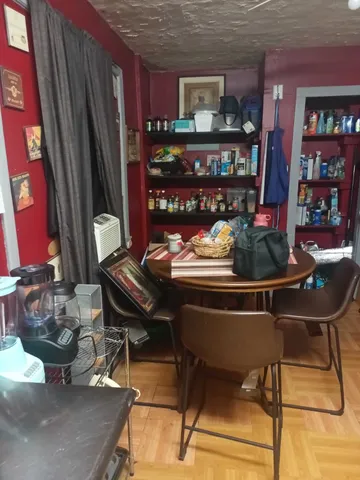 a outdoor dining space with furniture and rug