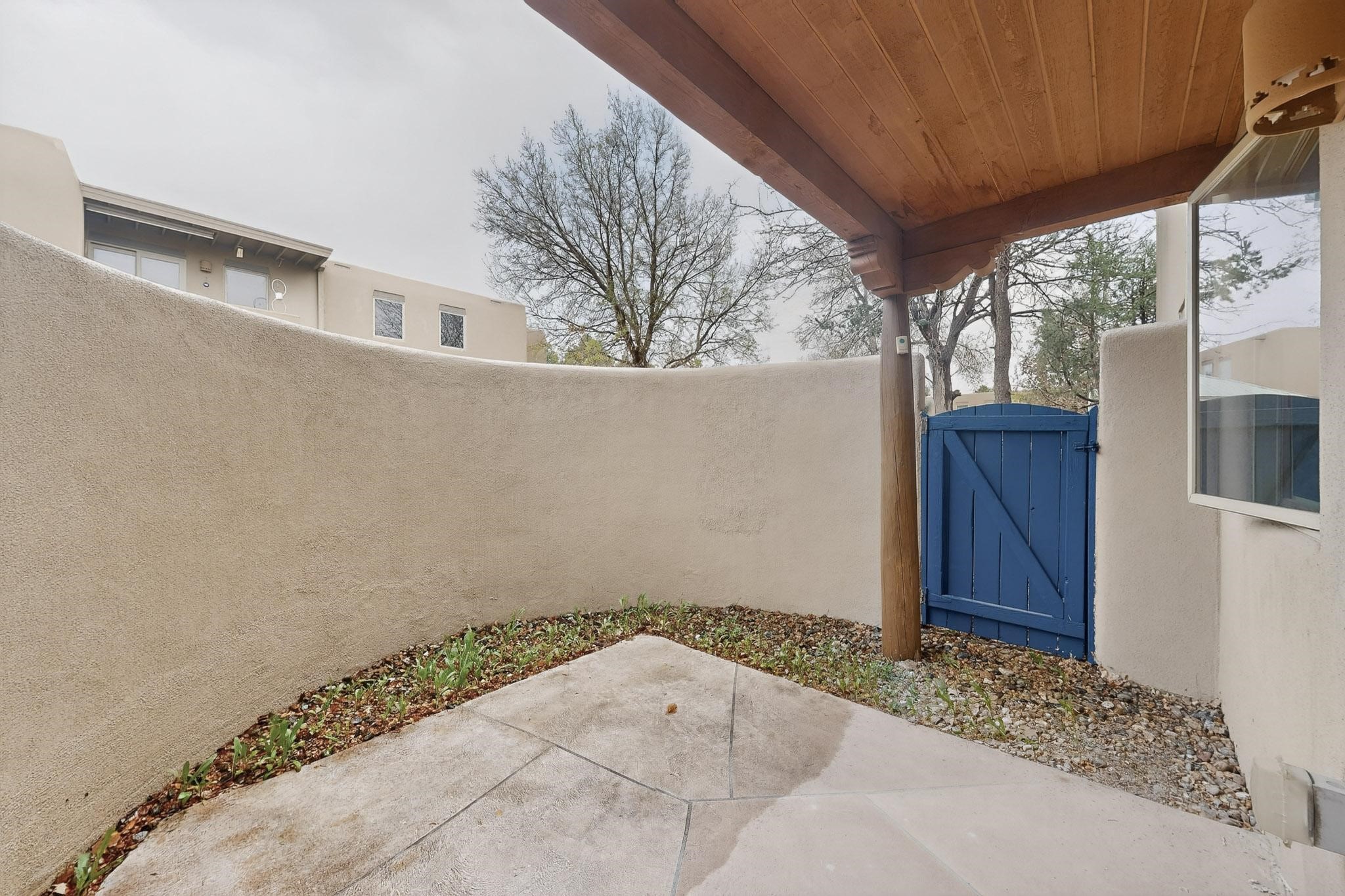 601 West San Mateo Road, Unit 27 Santa Fe, NM 87505 - Photo 15 of 27 Patio - Gated access to common area