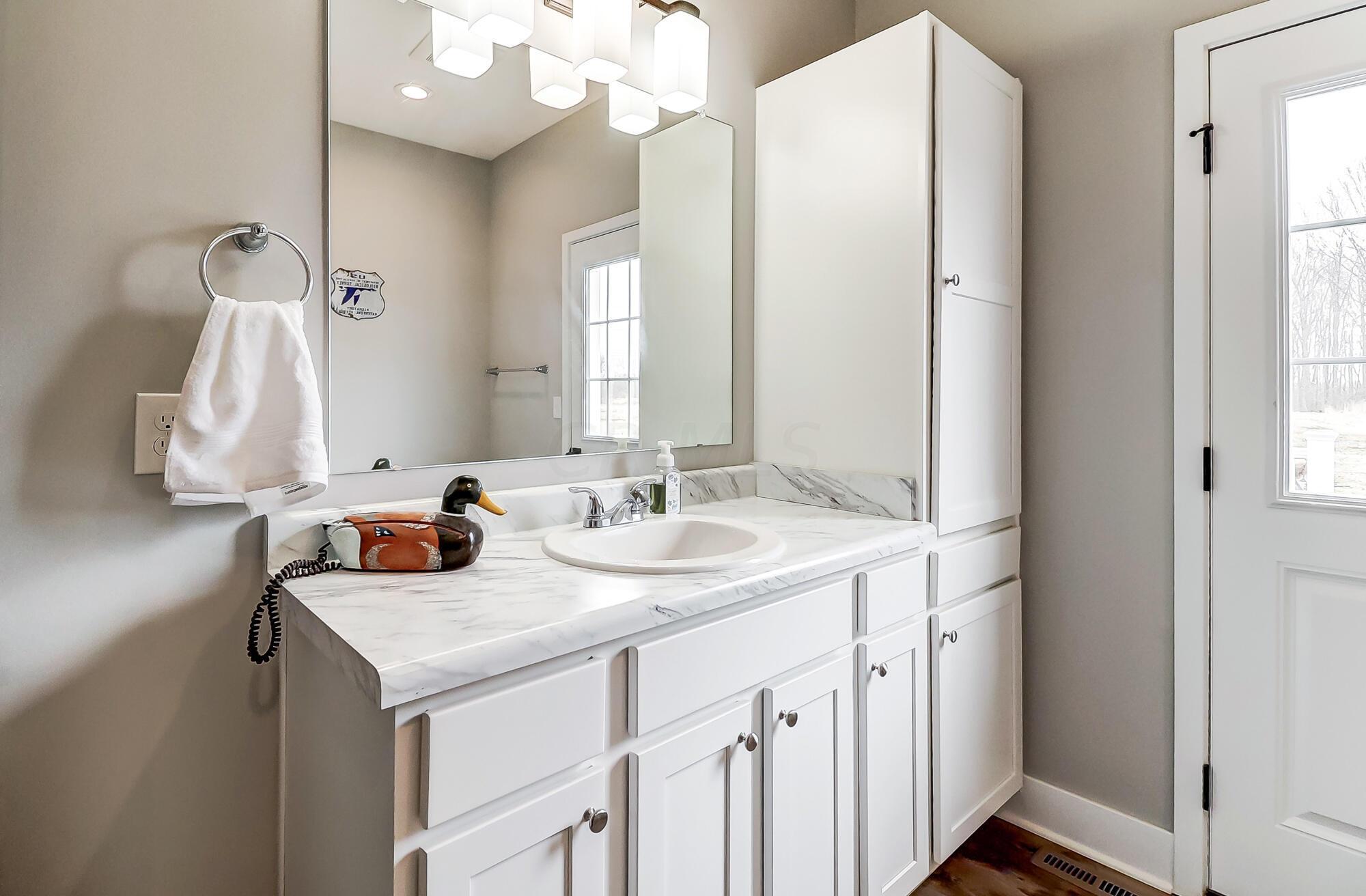 14295 Perfect Road Sunbury, OH 43074 - Photo 22 of 72 Half bath in den/guest suite - space for shower and could be full bath