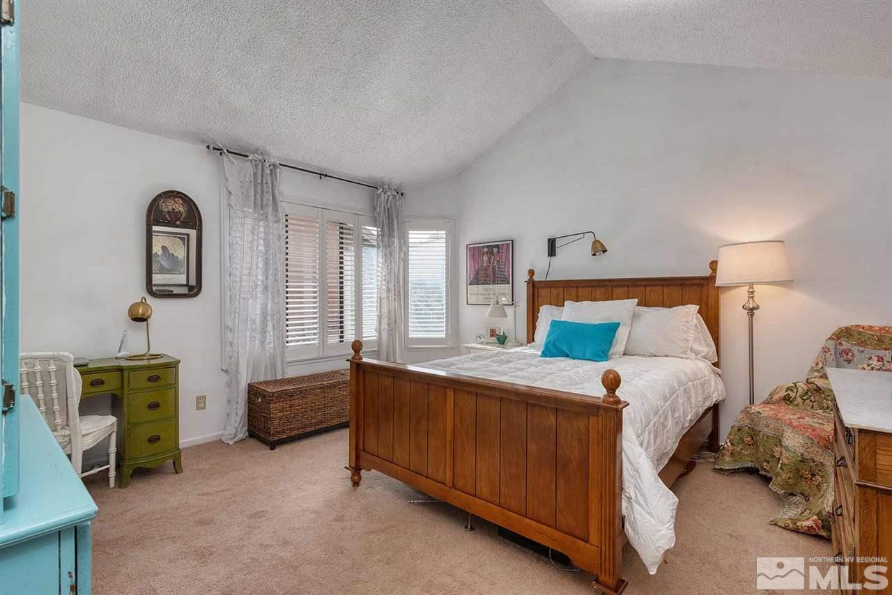2875 Idlewild Drive, Unit 58 Reno, NV 89509 - Photo 11 of 25 a bedroom with a bed and a window