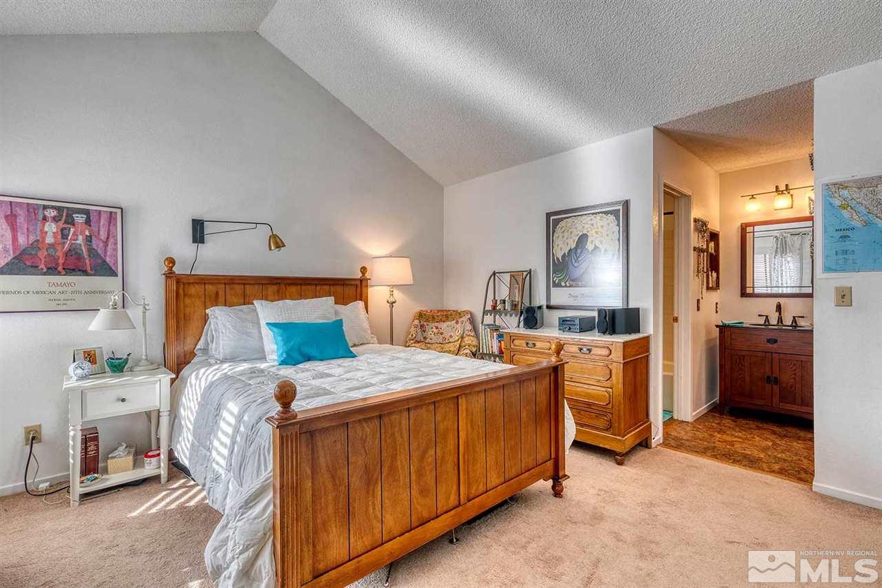 2875 Idlewild Drive, Unit 58 Reno, NV 89509 - Photo 12 of 25 a bedroom with a bed and a utility room