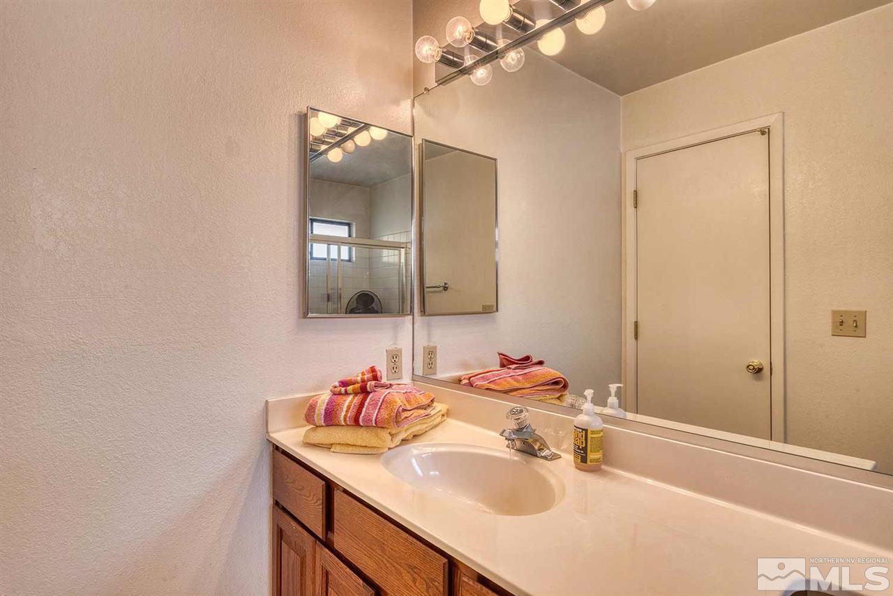 2875 Idlewild Drive, Unit 58 Reno, NV 89509 - Photo 17 of 25 a bathroom with a sink and a mirror