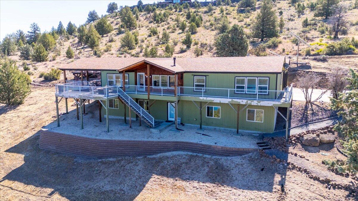 11182 Southwest Dynamite Lane Culver, OR 97734 - Photo 63 of 70 a view of a house with backyard porch and sitting area