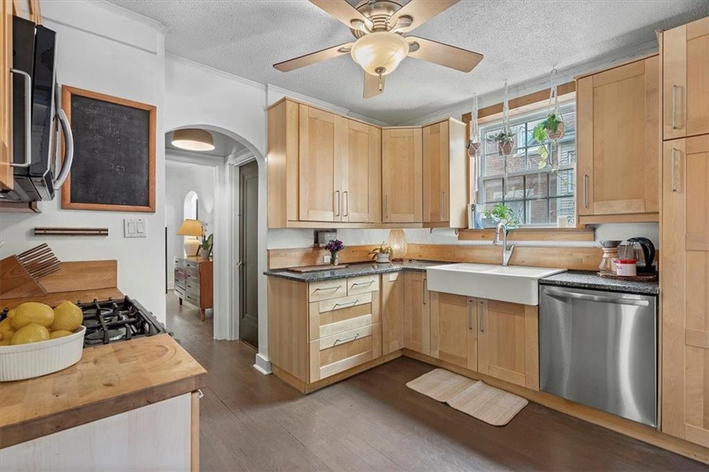 215 Elm Road Ambridge, PA 15003 - Photo 12 of 25 a kitchen with a stove a sink and a window