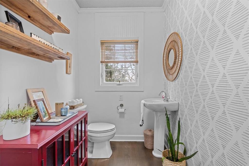 215 Elm Road Ambridge, PA 15003 - Photo 14 of 25 a bathroom with a toilet a sink and a mirror