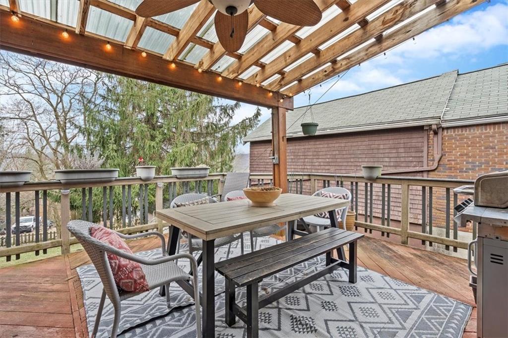 215 Elm Road Ambridge, PA 15003 - Photo 23 of 25 a roof deck with a table and chairs