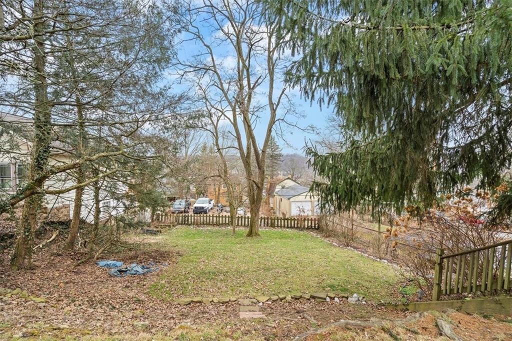 215 Elm Road Ambridge, PA 15003 - Photo 25 of 25 a backyard of apartments with large trees