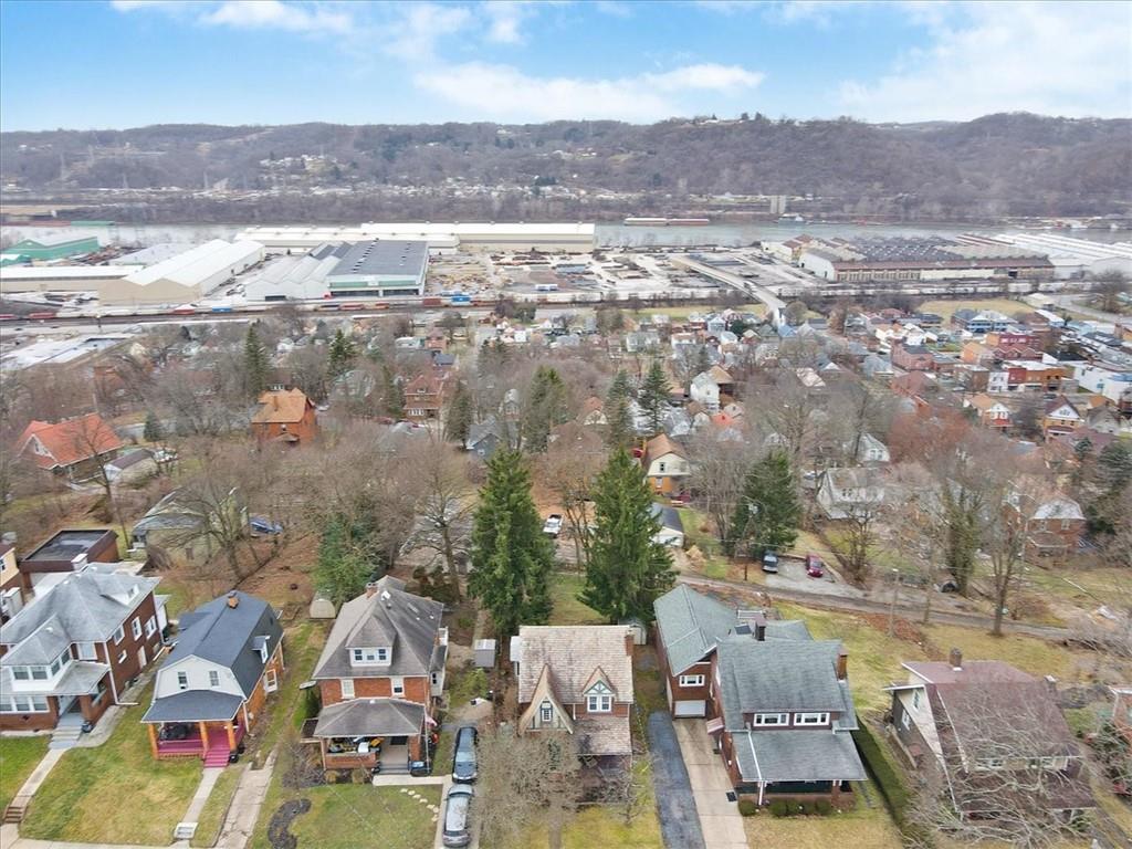 215 Elm Road Ambridge, PA 15003 - Photo 4 of 25 an aerial view of residential houses with outdoor space and mountain view