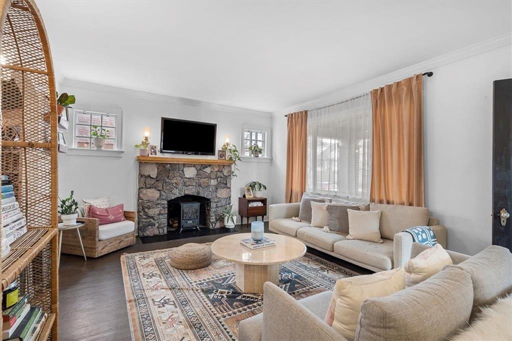 215 Elm Road Ambridge, PA 15003 - Photo 6 of 25 a living room with furniture a fireplace and a large window