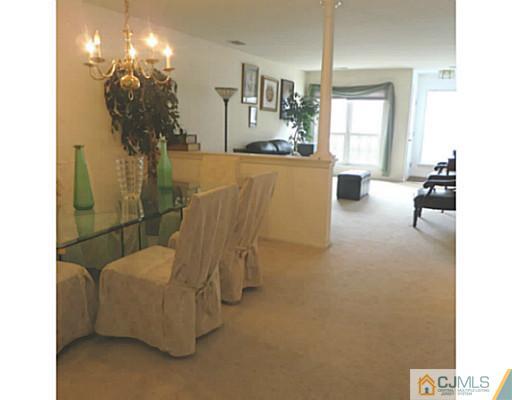 2403 Pheasant Run Monmouth Junction, NJ 08852 - Photo 3 of 10 a living room with furniture and a chandelier