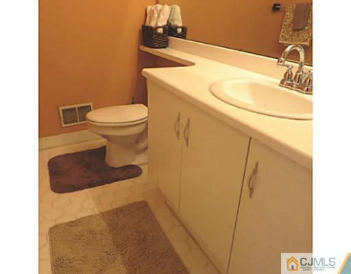 2403 Pheasant Run Monmouth Junction, NJ 08852 - Photo 9 of 10 a bathroom with a sink and a toilet