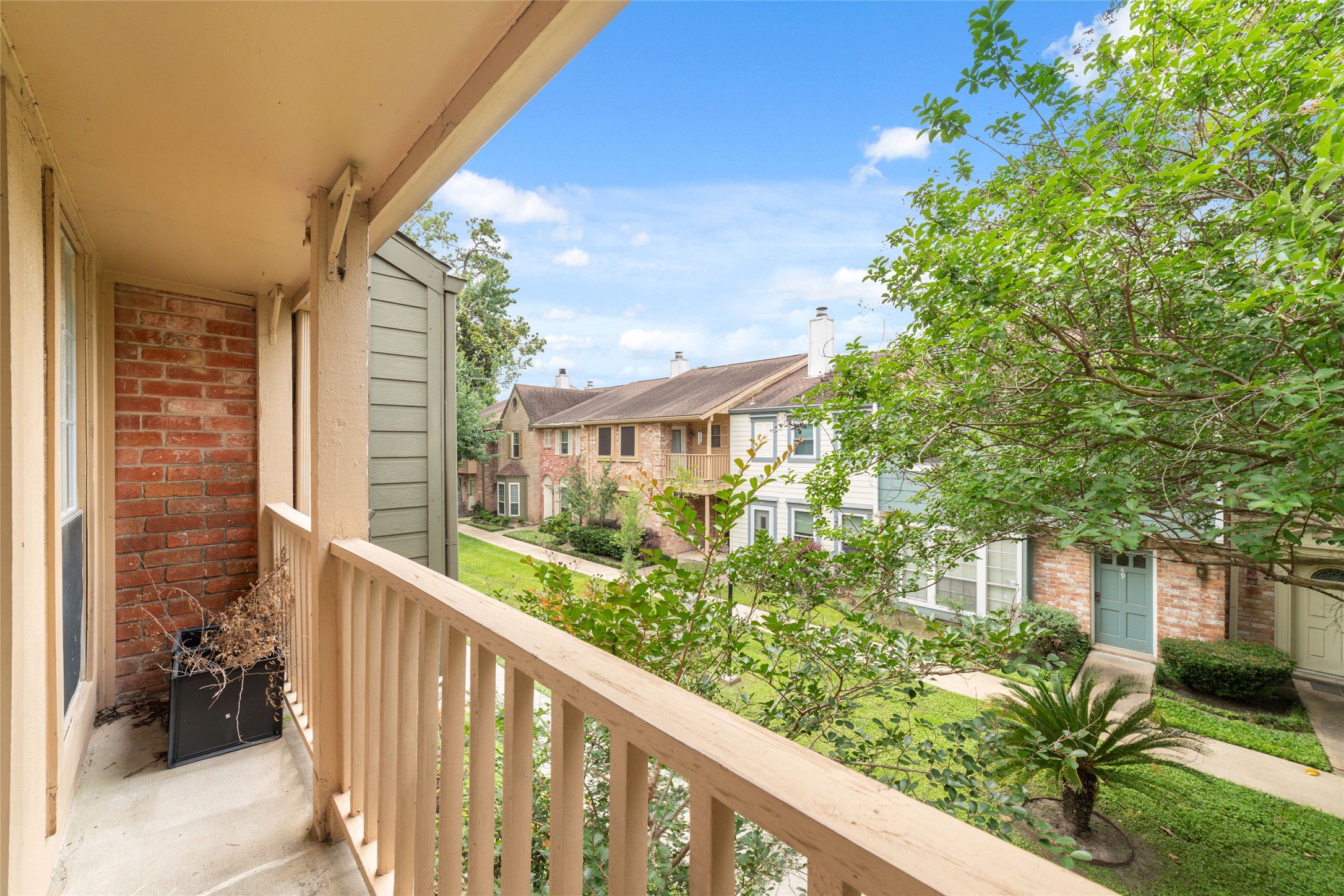 5800 Lumberdale Road, Unit 55 Houston, TX 77092 - Photo 23 of 34 a view of a porch with a yard