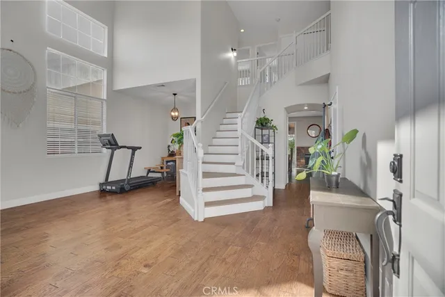 a view of a hallway with stairs and a couch