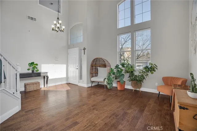 a view of an entryway with wooden floor