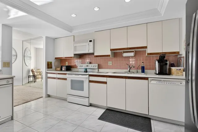 a view of swimming pool with outdoor seating and lake