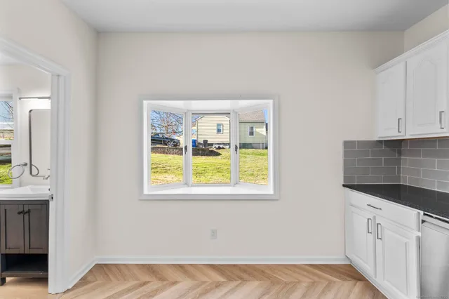 a kitchen with a sink stove and refrigerator