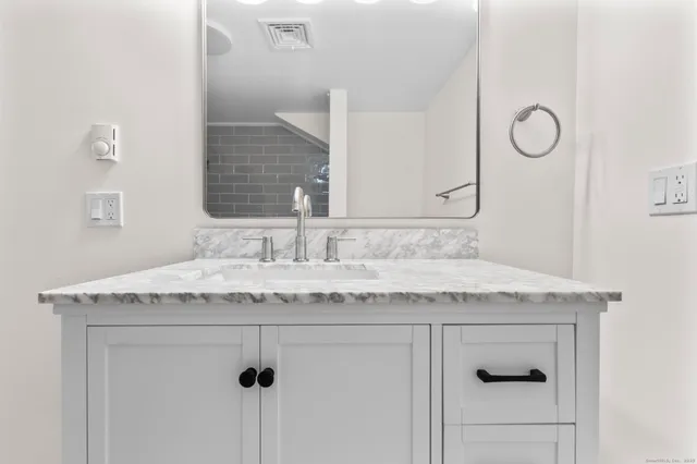 a bathroom with a shower and a bathtub