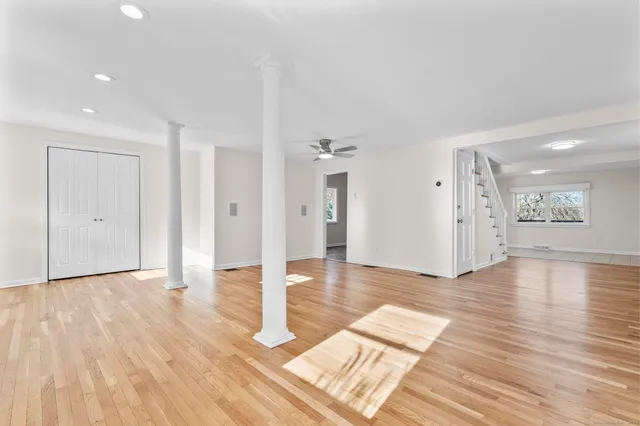 a view of an entryway with wooden floor