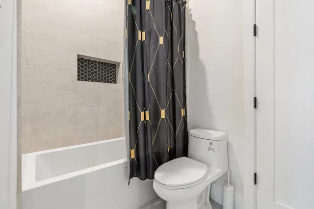 a bathroom with a granite countertop sink a large mirror and vanity