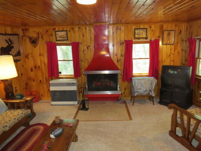 63 Salisbury Cove Road Otis, ME 04605 - Photo 7 of 34 Living room area with wood burning...