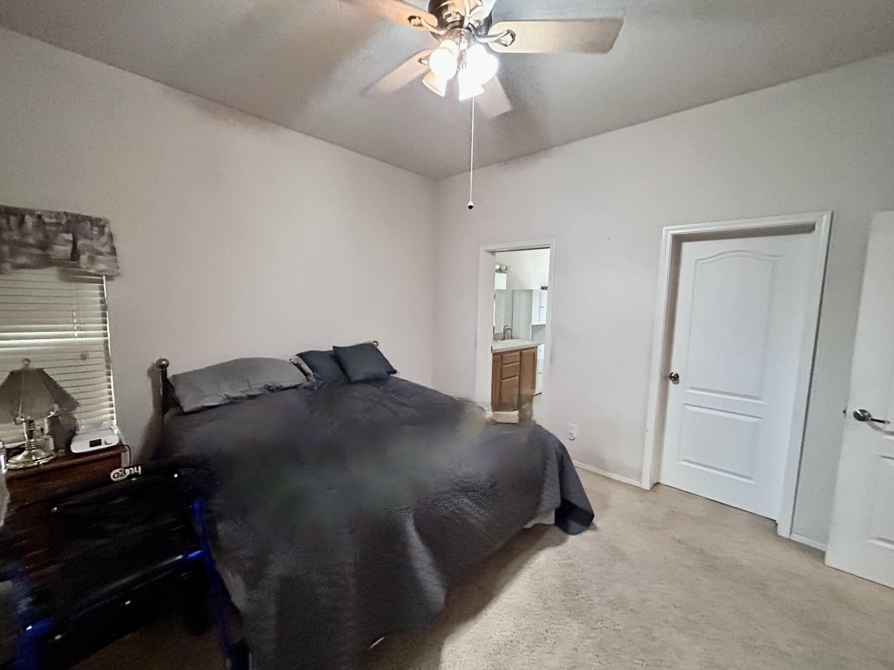 7150 Kaysie Rae Court Shingletown, CA 96088 - Photo 11 of 34 a bed room with a bed and a ceiling fan