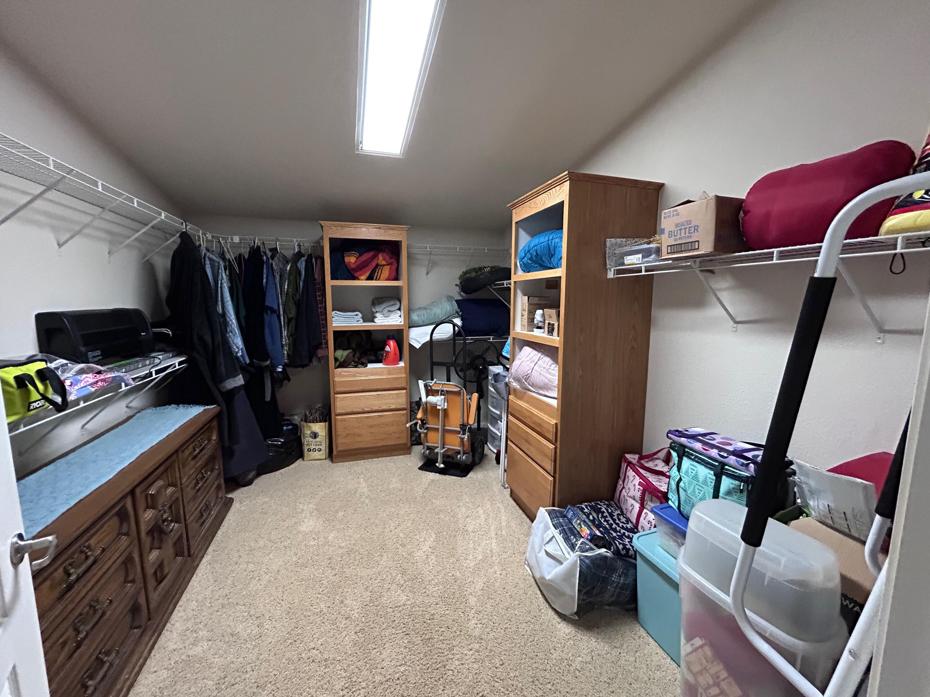 7150 Kaysie Rae Court Shingletown, CA 96088 - Photo 15 of 34 a view of walk in closet with clothes and shoes