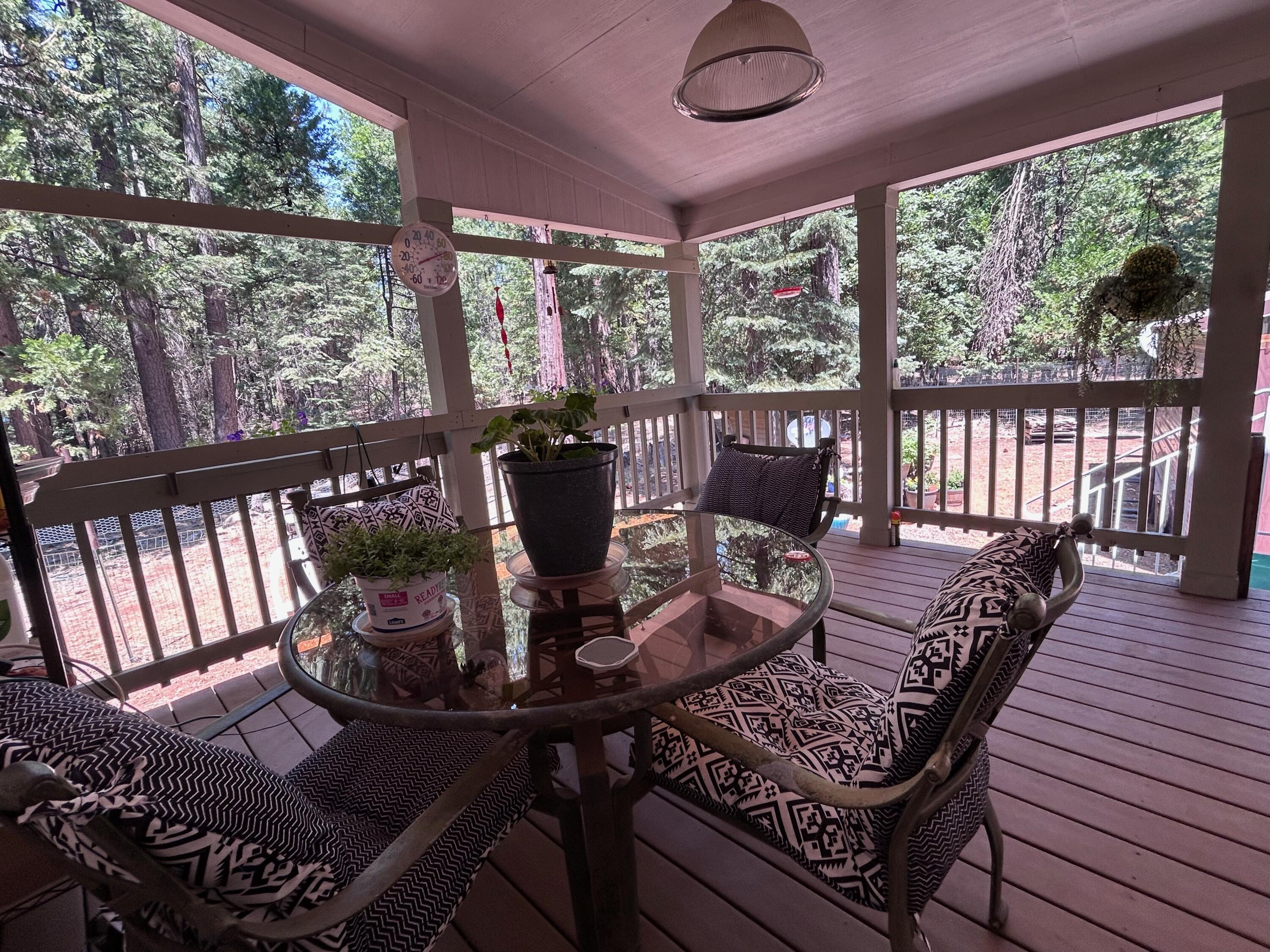 7150 Kaysie Rae Court Shingletown, CA 96088 - Photo 20 of 34 a view of a dining room with furniture wooden floor and chandelier