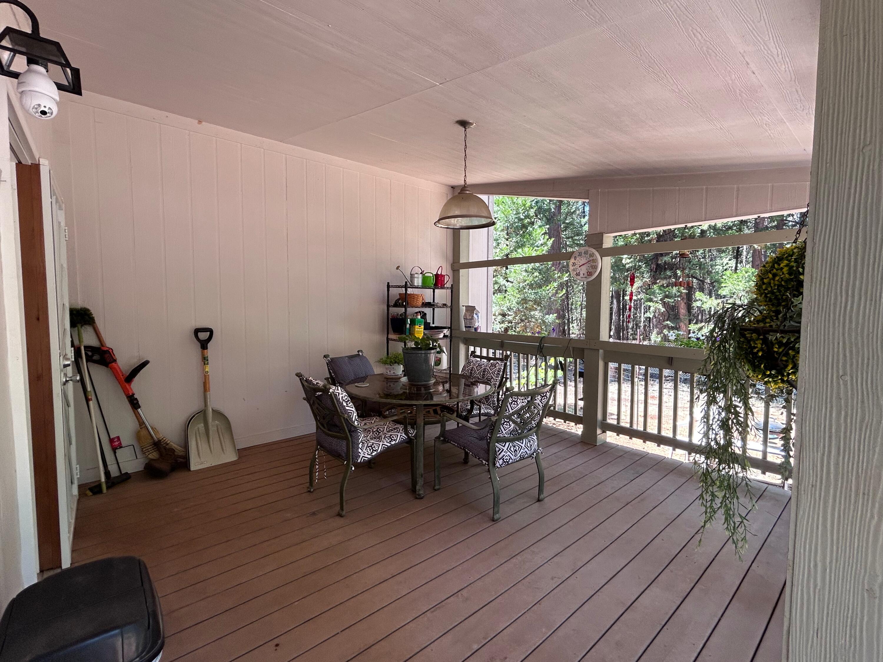 7150 Kaysie Rae Court Shingletown, CA 96088 - Photo 21 of 34 a dining room with furniture wooden floor and a rug
