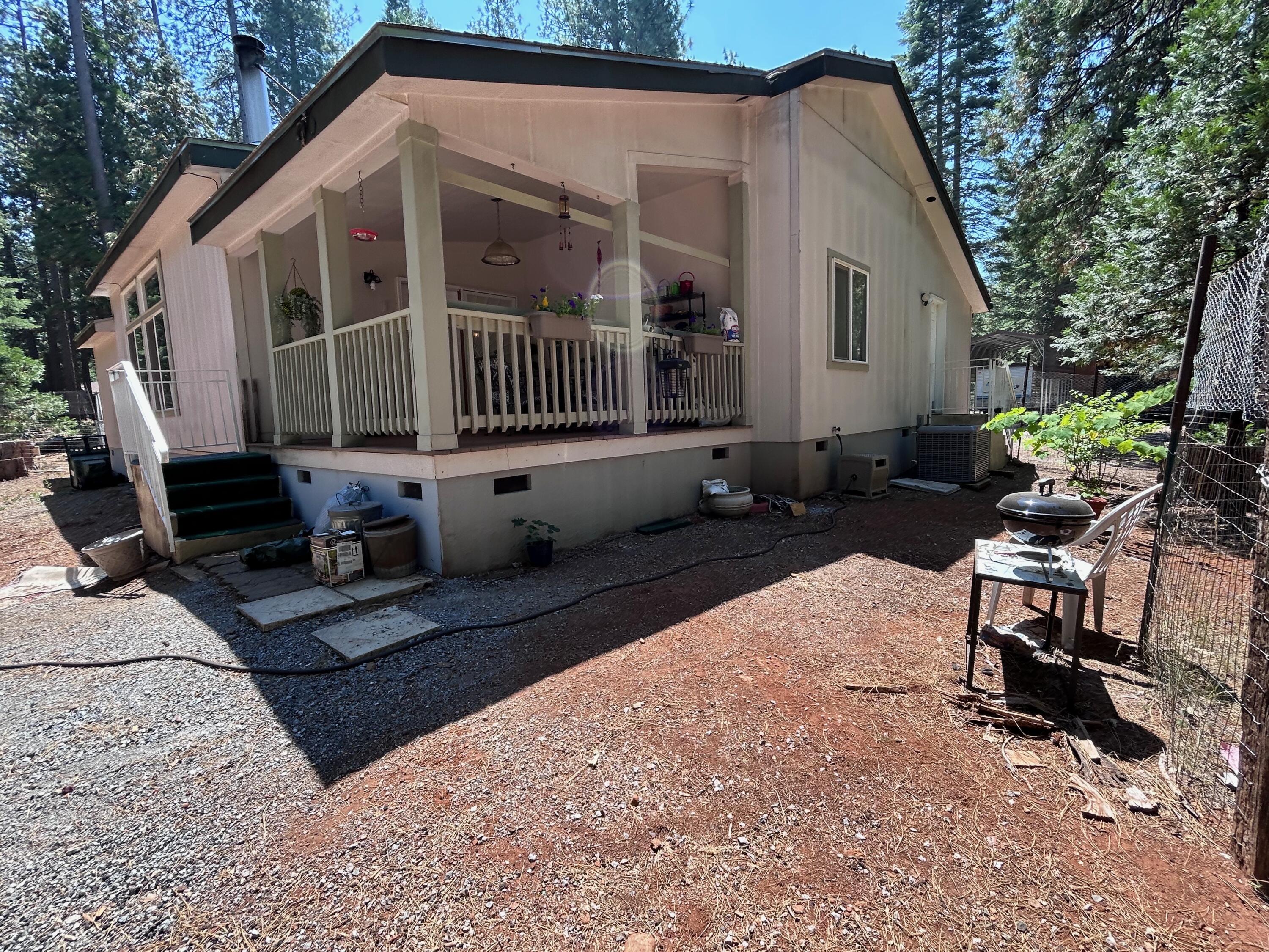 7150 Kaysie Rae Court Shingletown, CA 96088 - Photo 22 of 34 a view of a house with backyard and sitting area