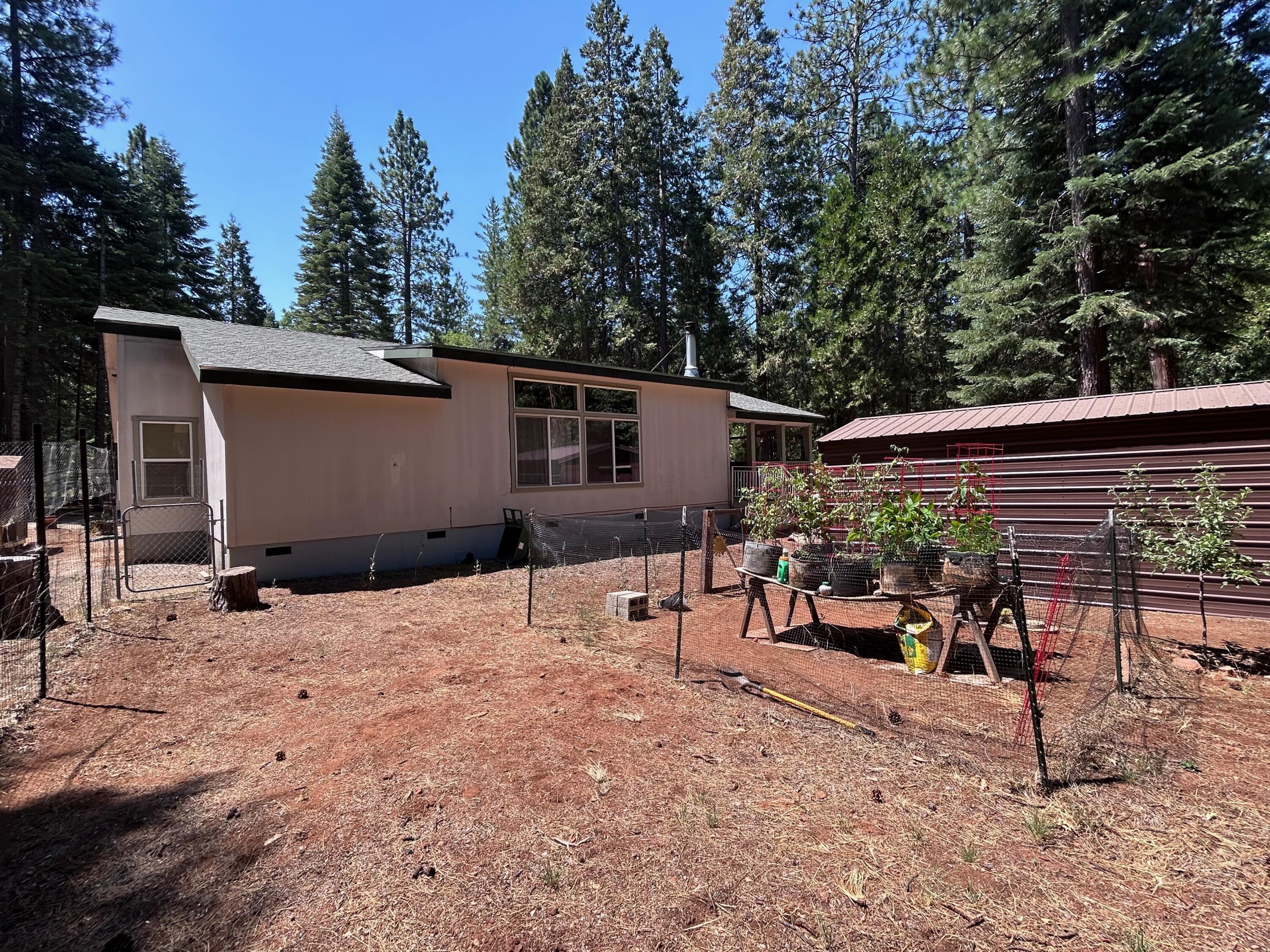 7150 Kaysie Rae Court Shingletown, CA 96088 - Photo 26 of 34 a view of a backyard with a sitting area
