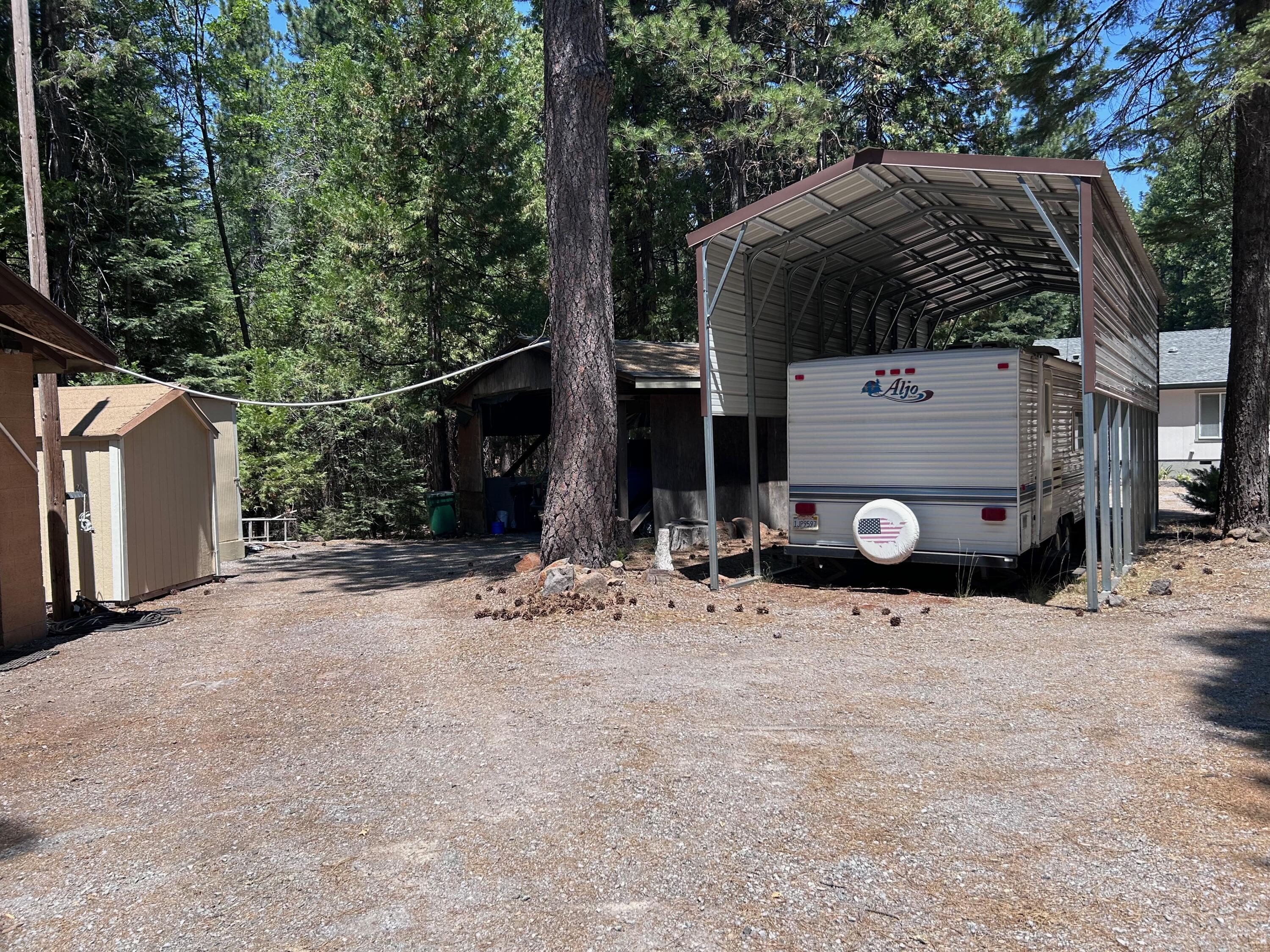 7150 Kaysie Rae Court Shingletown, CA 96088 - Photo 30 of 34 a view of a house with backyard and trees