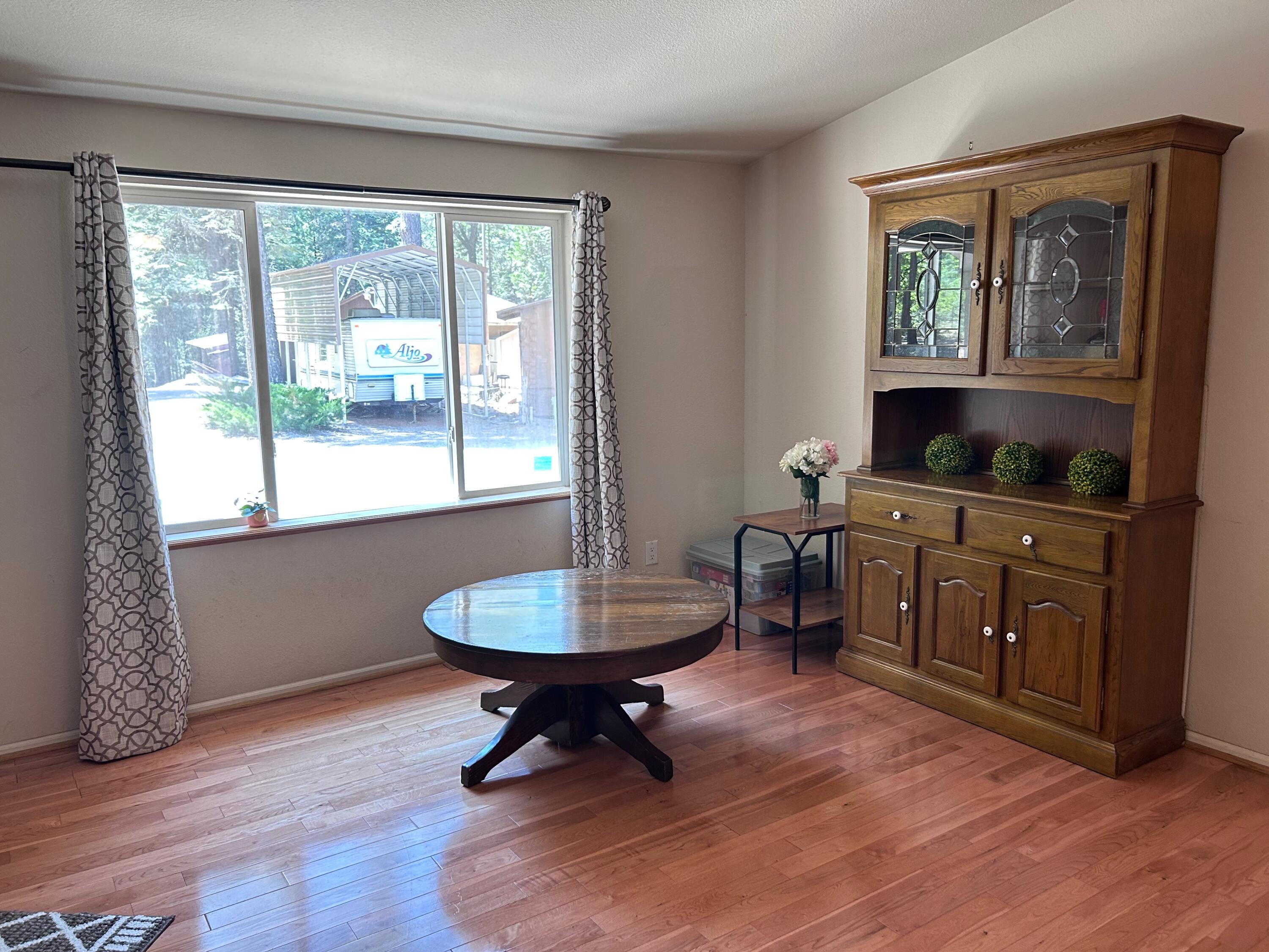 7150 Kaysie Rae Court Shingletown, CA 96088 - Photo 3 of 34 a living room with furniture and a window