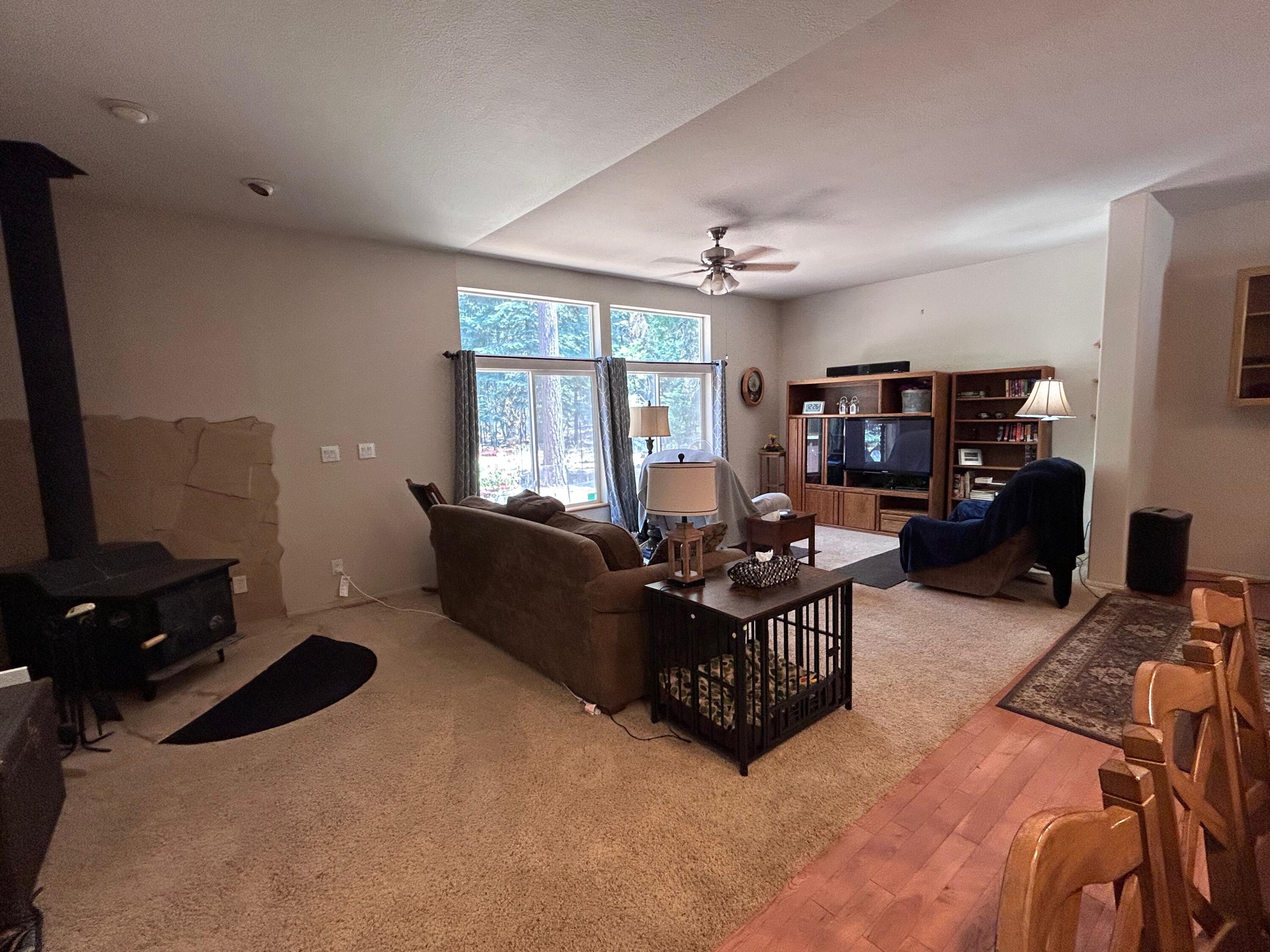 7150 Kaysie Rae Court Shingletown, CA 96088 - Photo 9 of 34 a living room with furniture window and a flat screen tv