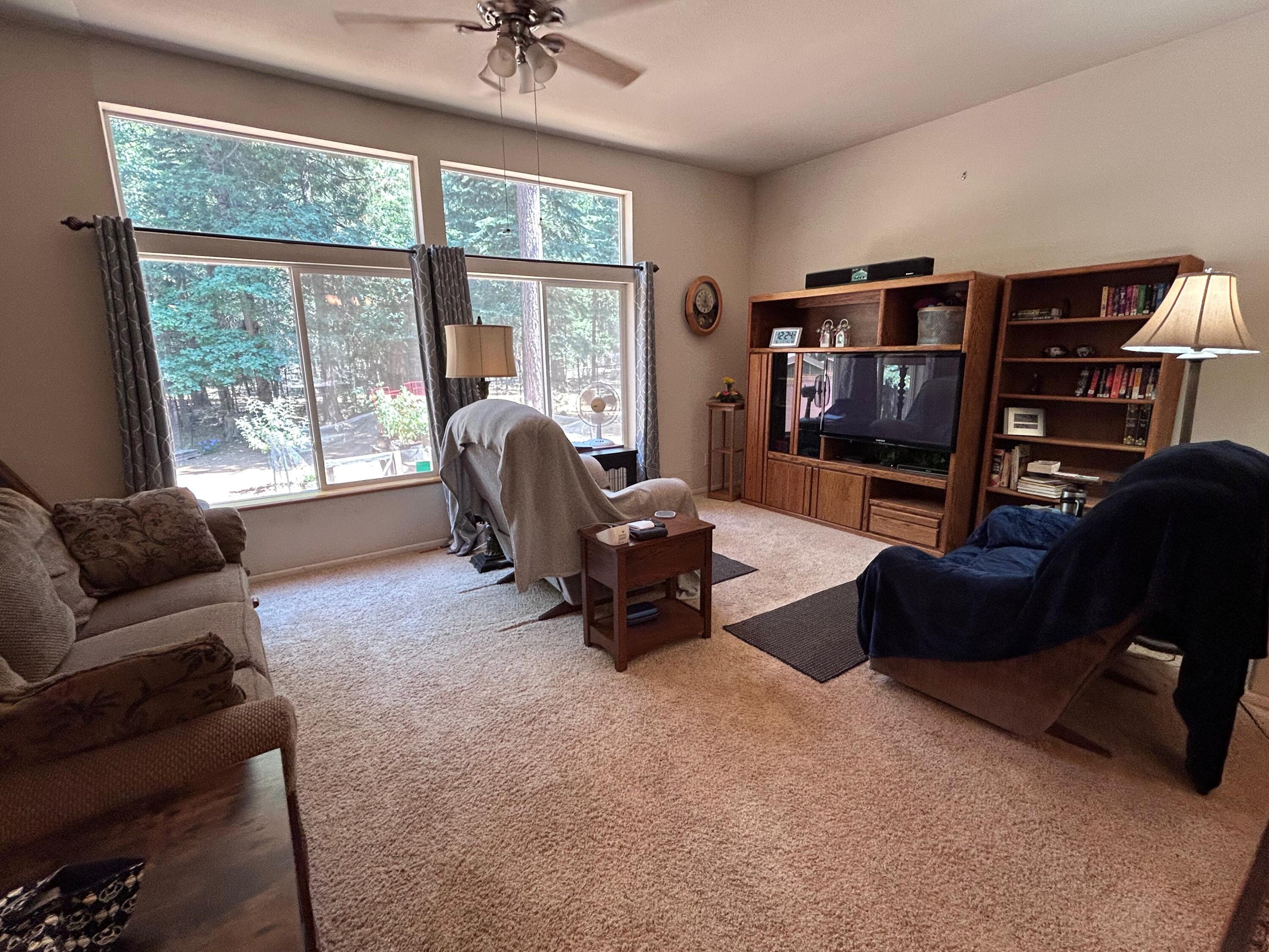 7150 Kaysie Rae Court Shingletown, CA 96088 - Photo 10 of 34 a living room with furniture and a flat screen tv