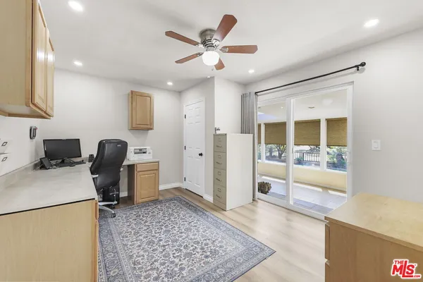 a workspace with furniture and a rug