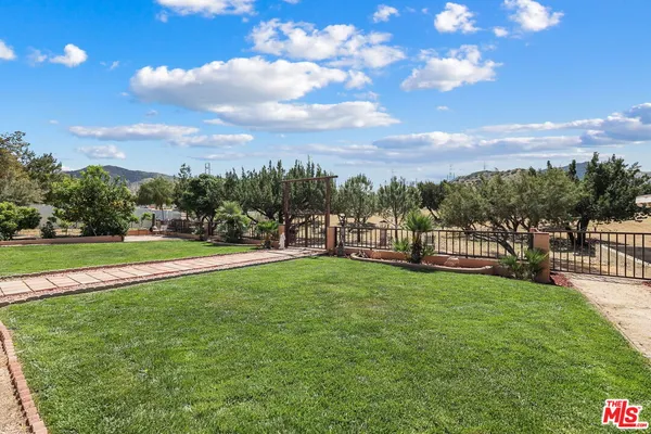a view of a garden and mountains