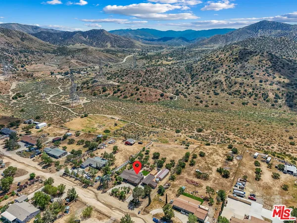 an aerial view of residential house with parking space