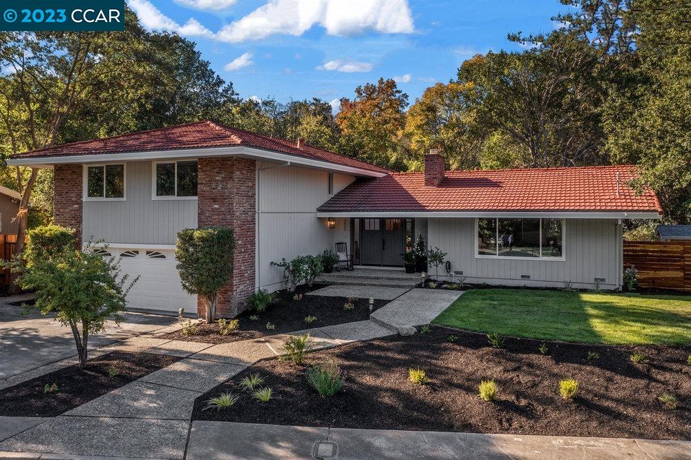 a front view of a house with garden