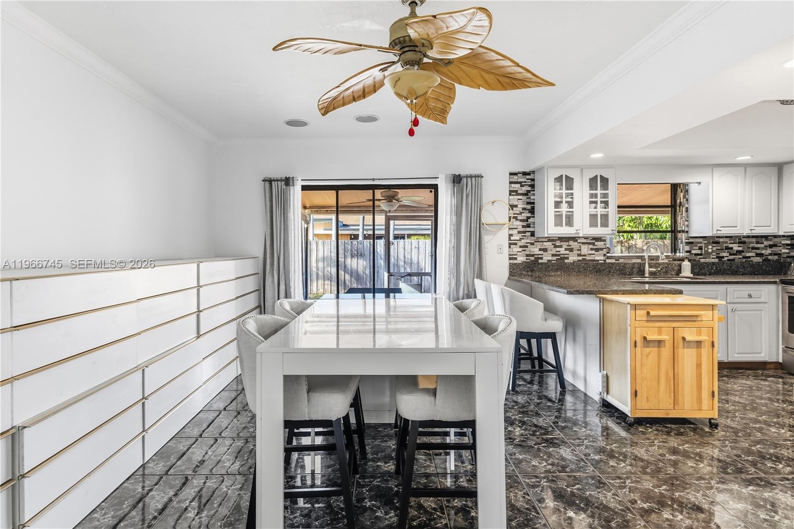 11753 Southwest 197th Street Miami, FL 33177 - Photo 11 of 36 a kitchen with granite countertop a stove a sink and a refrigerator