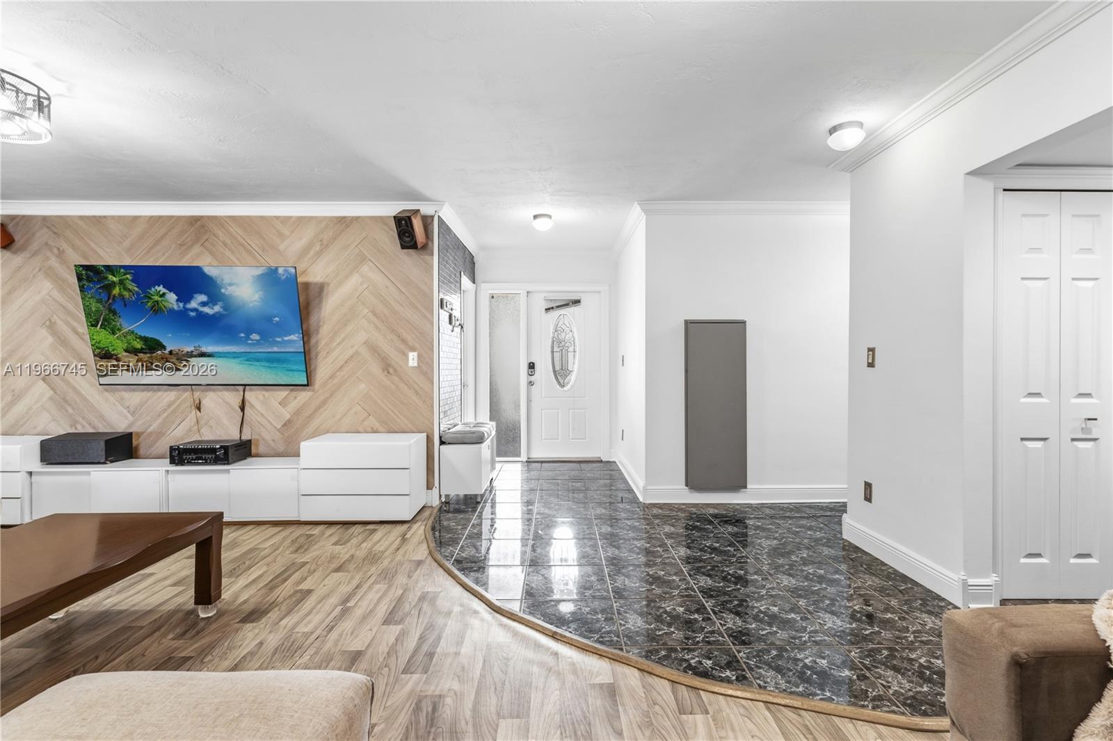 11753 Southwest 197th Street Miami, FL 33177 - Photo 13 of 36 a living room with furniture and a rug